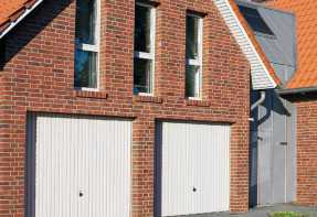 house with completed two car steel garage door
