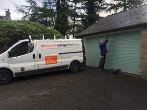 Dimension Garage Doors installing a roller garage door