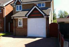 house with finished white side hinged garage door